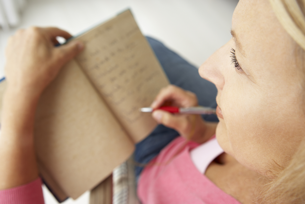 woman_writing_journal_anxiety_worry_DP