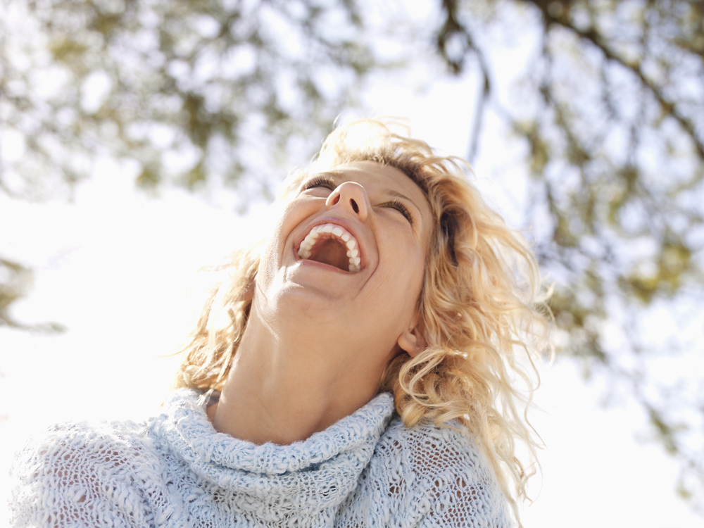 women joyfully laughing and having a good time